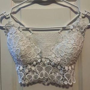 Women’s white lace crop top, size medium would probably fit as a small.